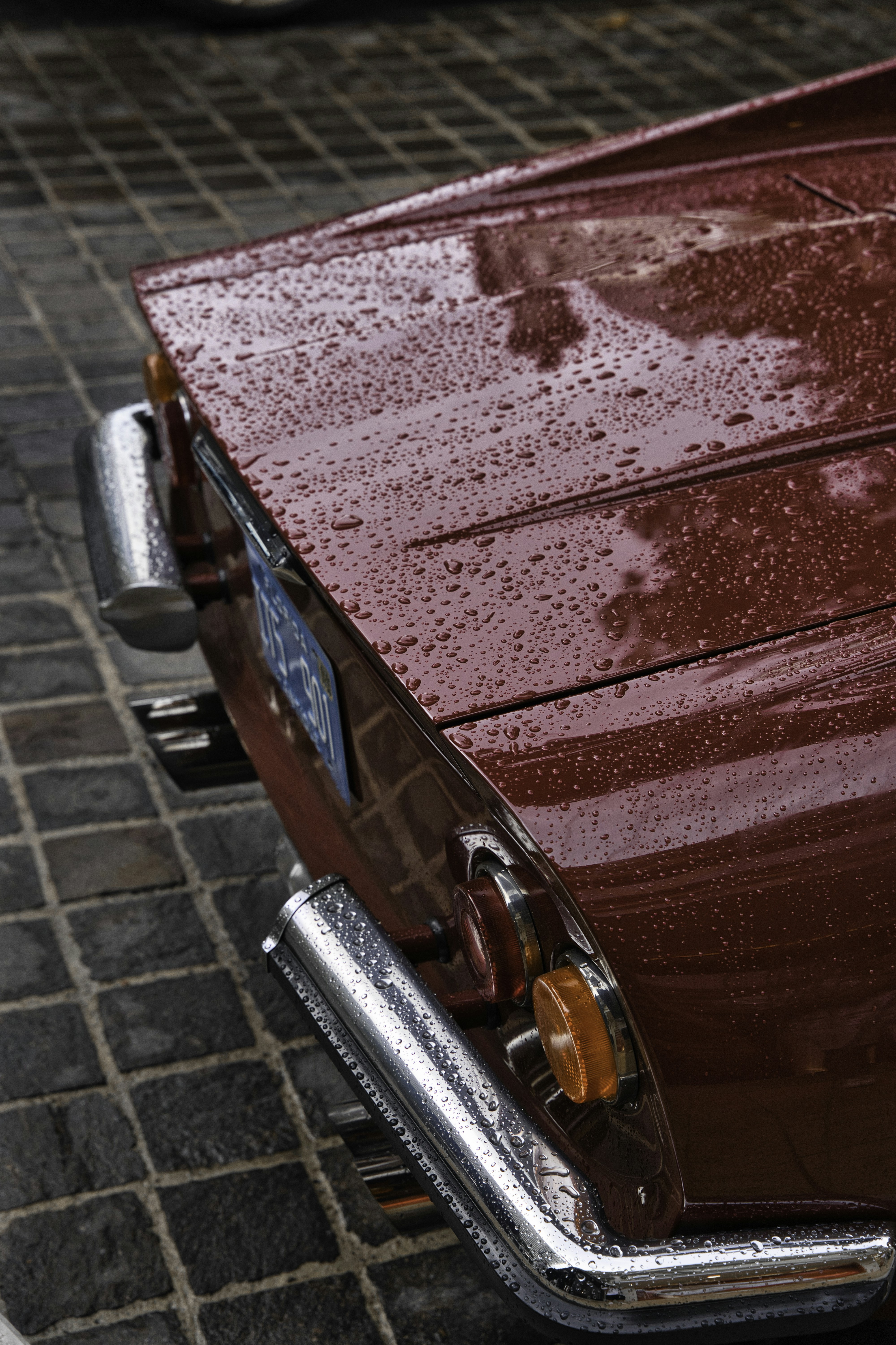 a close up of a car parked on a street