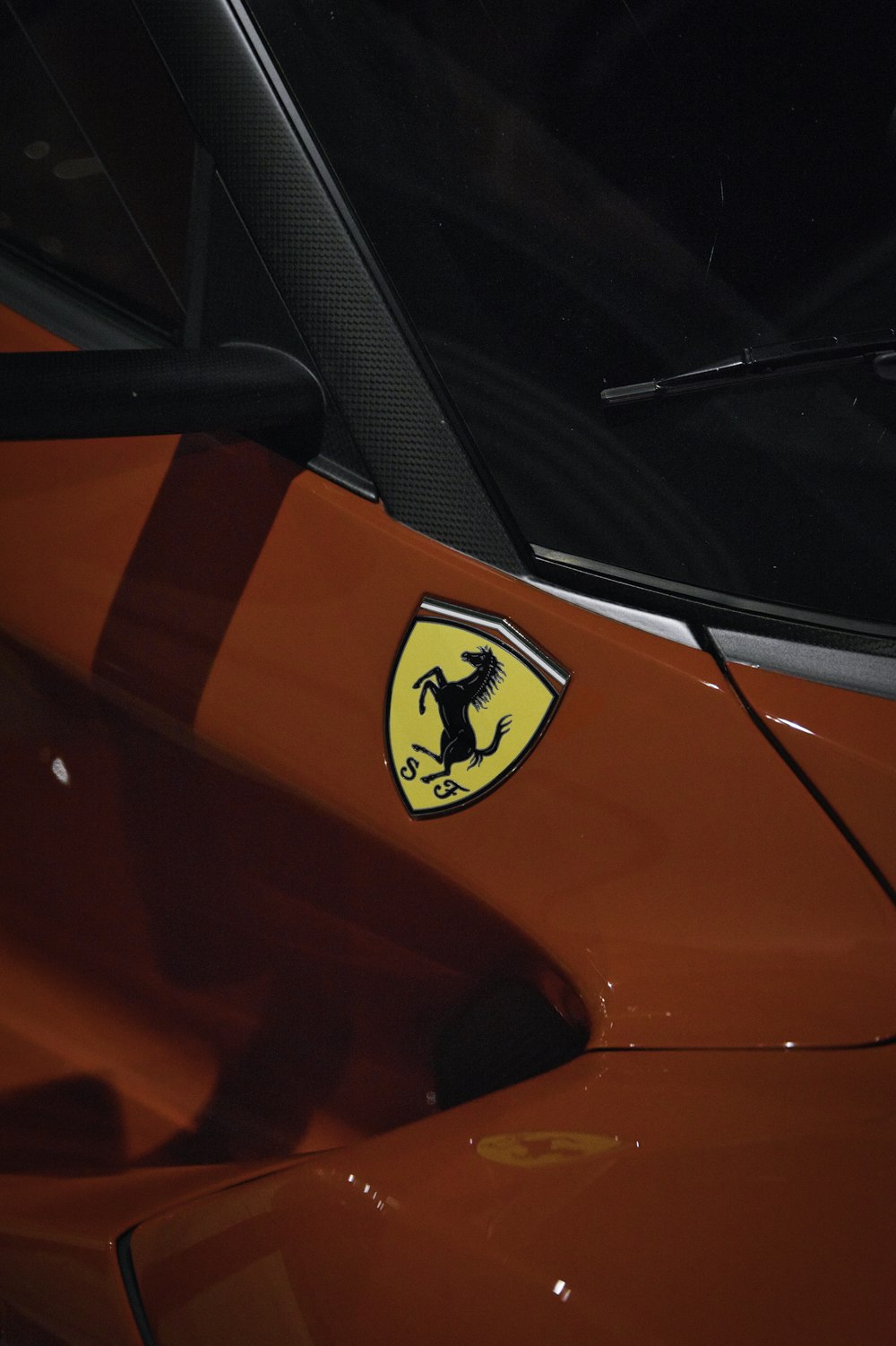 a close up of a ferrari logo on a car
