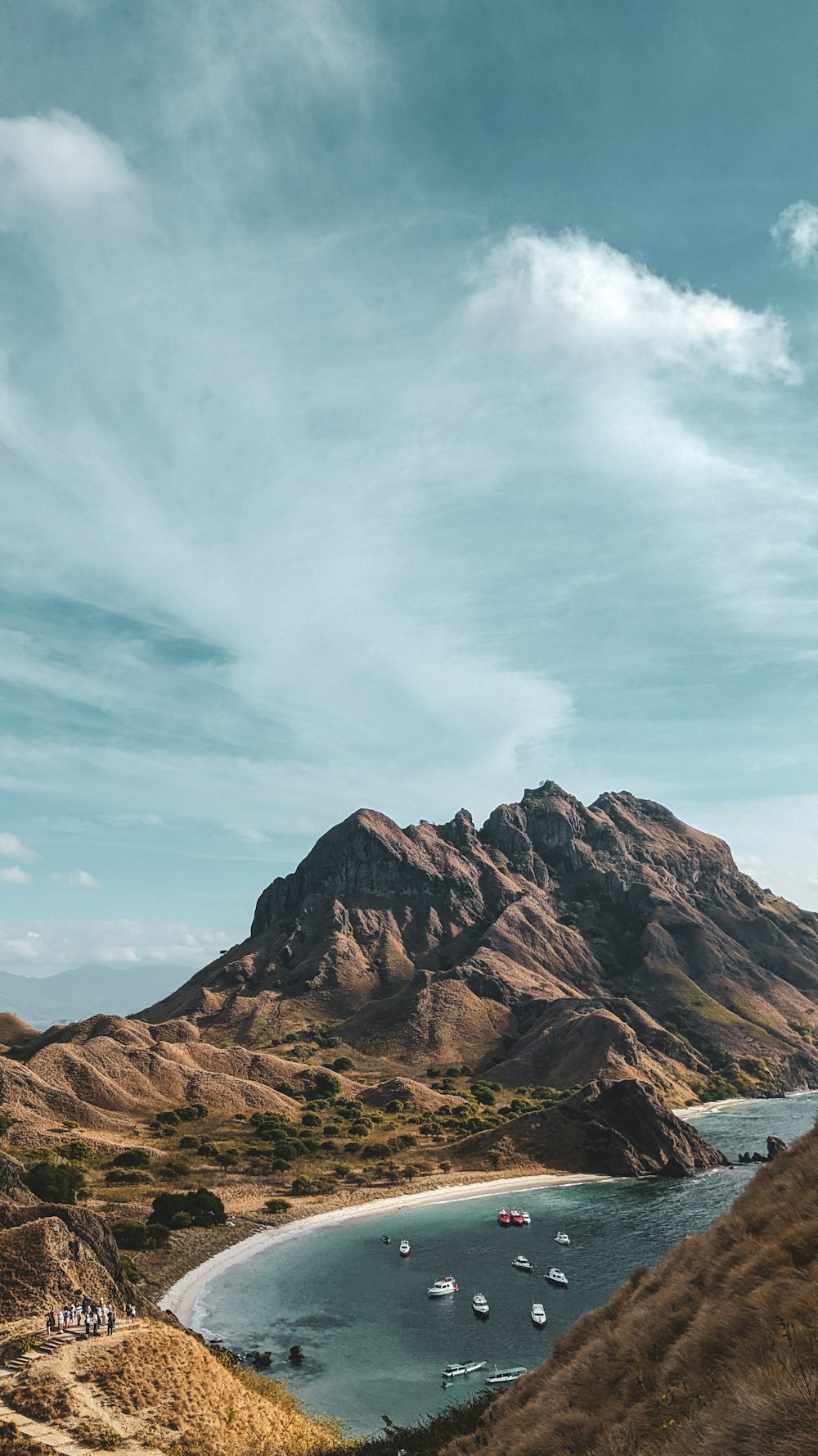 a view of a beach with a mountain in the background