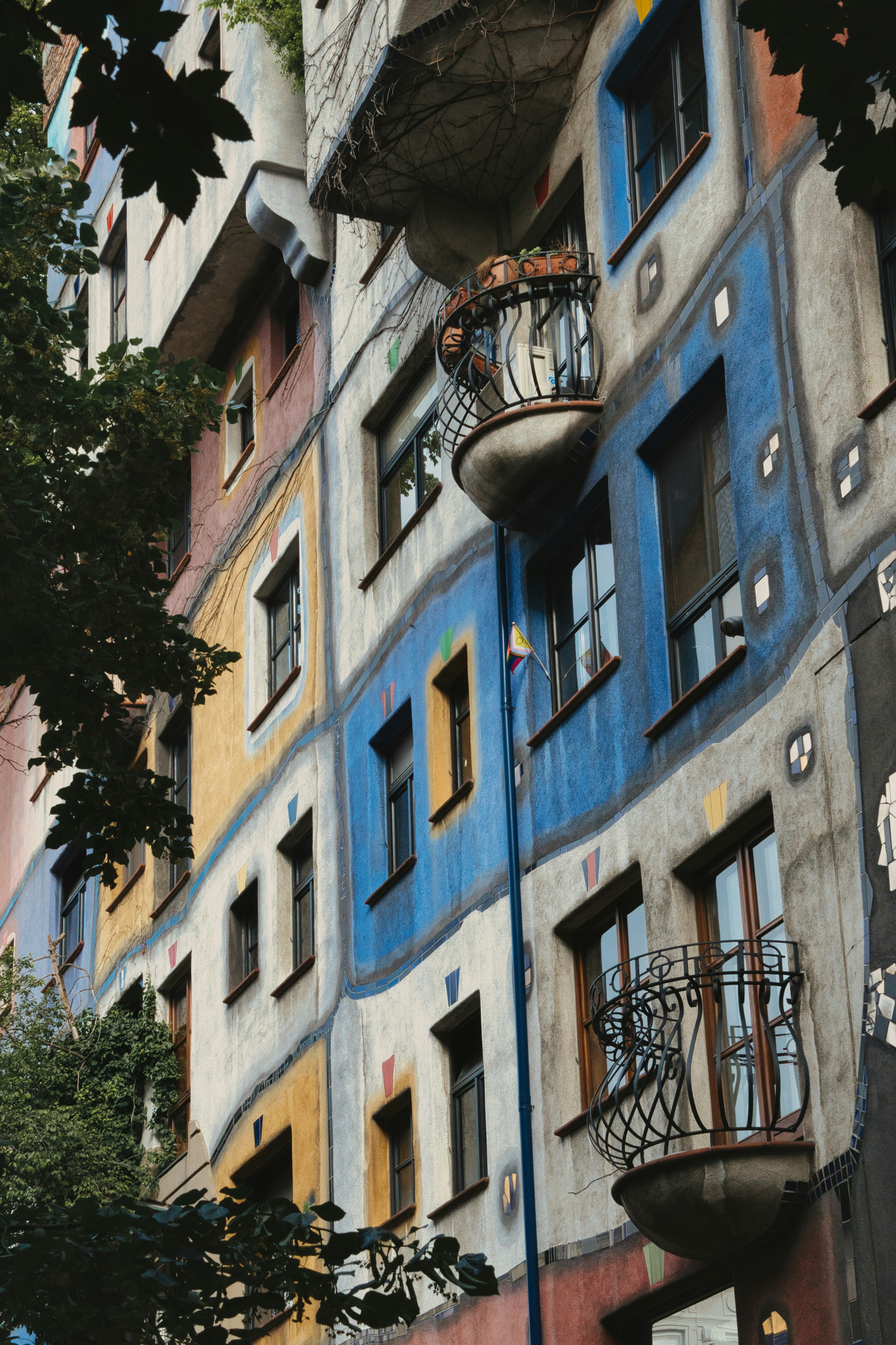 a tall building with many windows and balconies