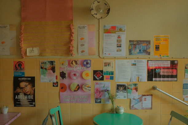 Close-up of a happy customer checking a promotional flyer in a cozy café.