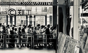 A candid moment of voters lining up outside a polling station.