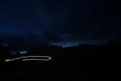 A nighttime cinematic shot displaying stunning color grading and a moody atmosphere.