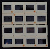 A neat grid of fifteen diverse images, each with a clear 'click here' button overlay.