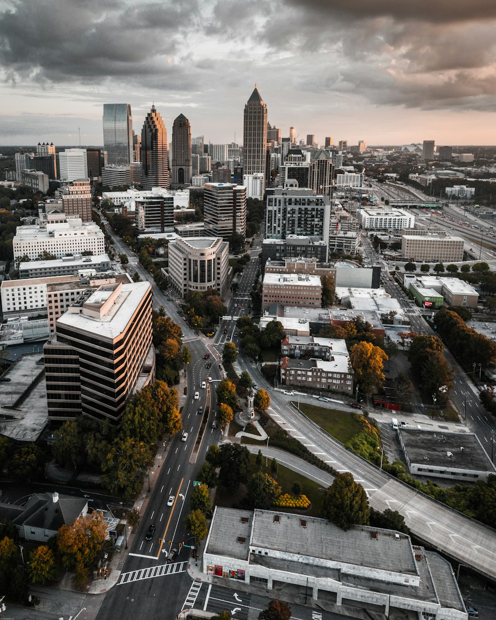 an aerial view of a city with tall buildings