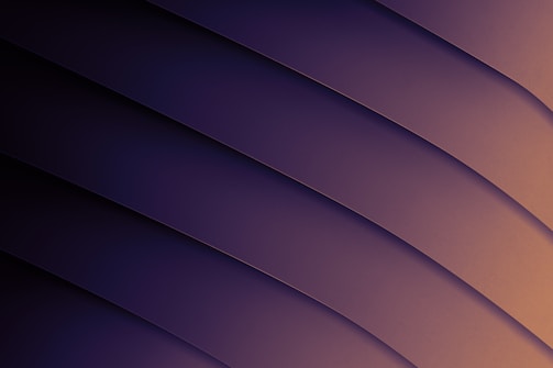 A series of diagonal, layered curves create a sleek and modern abstract design. The gradient shifts smoothly from deep purple to soft brown, providing a sophisticated visual effect.