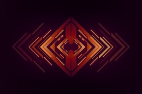 a dark background with an orange and red pattern