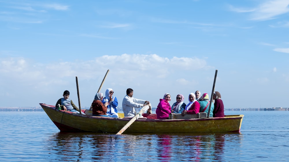 a group of people riding on the back of a boat