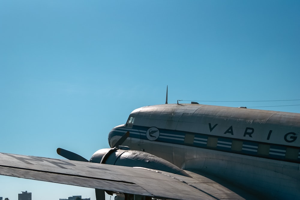 a large propeller plane sitting on top of an airport tarmac