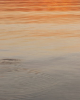 A serene meditation scene with soft golden and violet hues reflecting spiritual calmness.