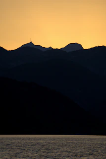 A vibrant digital painting of a serene mountain landscape at sunset, showcasing rich colors and fine detail.