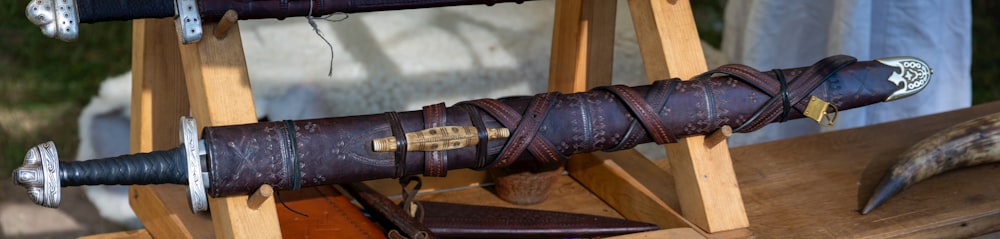 a wooden stand with a leather umbrella on it