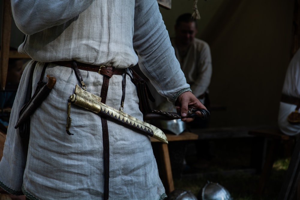 a close up of a person holding a knife