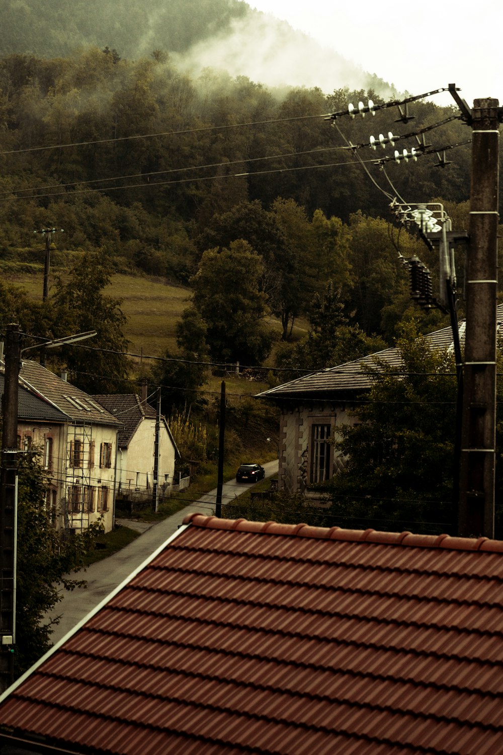 a view of a town with a mountain in the background