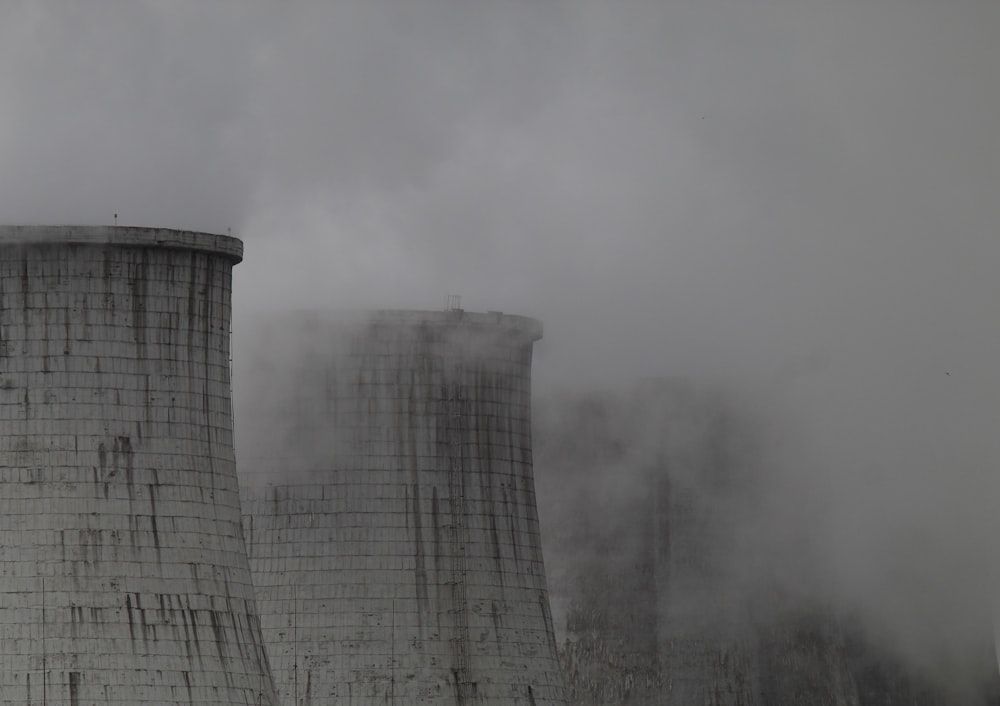 smoke billows from the cooling towers of a coal fired power plant