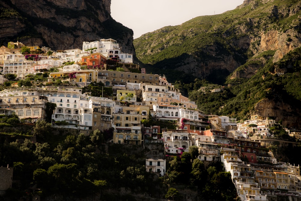 a city on a hill with a mountain in the background