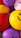 Happy children playing with colorful balloons and smiling faces at a lively birthday party.