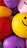 Happy children playing with colorful balloons and smiling faces at a lively birthday party.