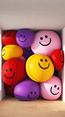 A cheerful display of soft balls, cushions, and accessories in bright colors and fun shapes.