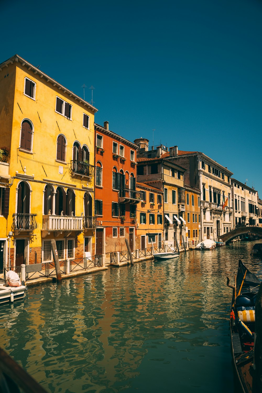 a row of buildings next to a body of water