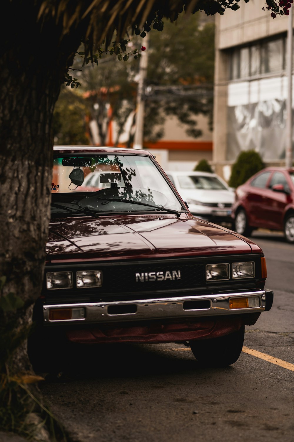 a red car parked on the side of the road