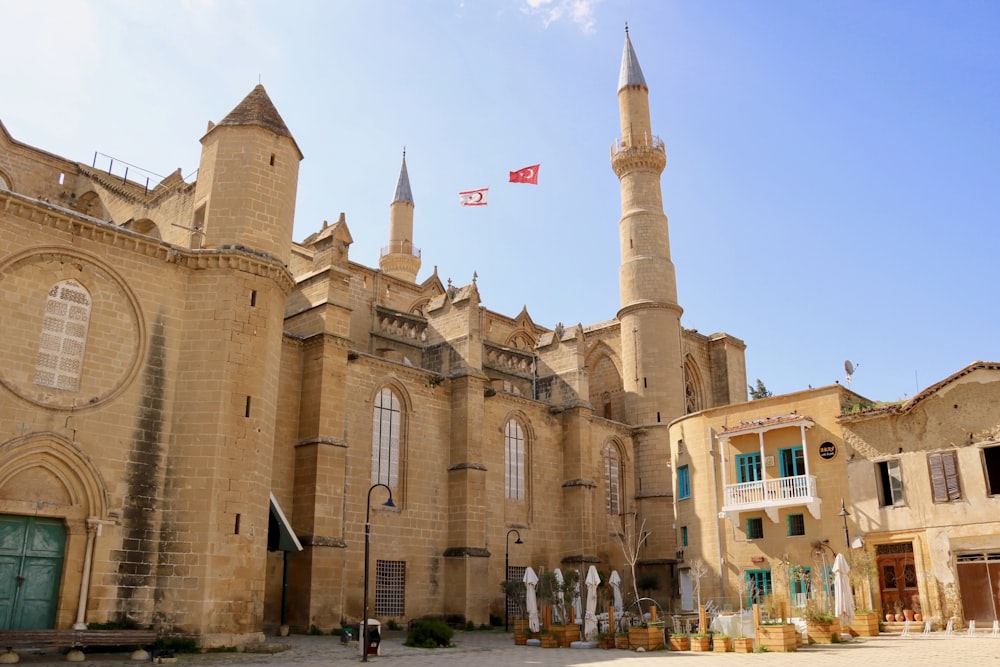 an old building with a flag flying in front of it