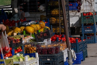 Fresh groceries including fruits and vegetables in reusable bags at a local market