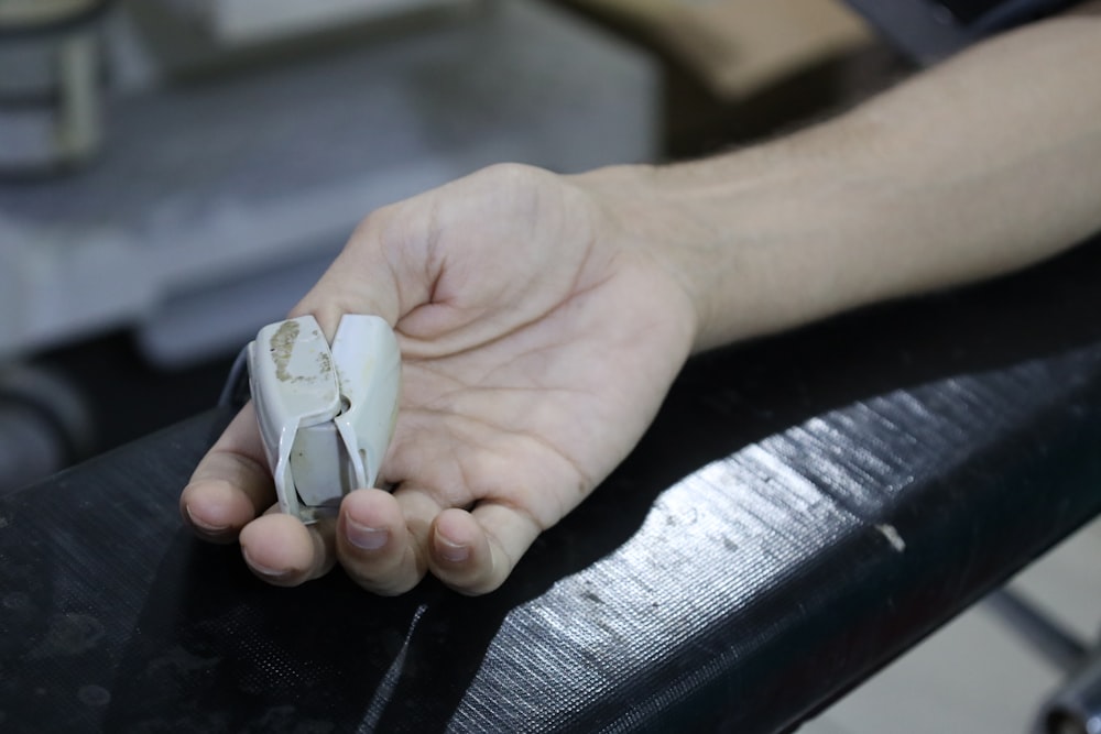 a person holding a piece of paper in their hand