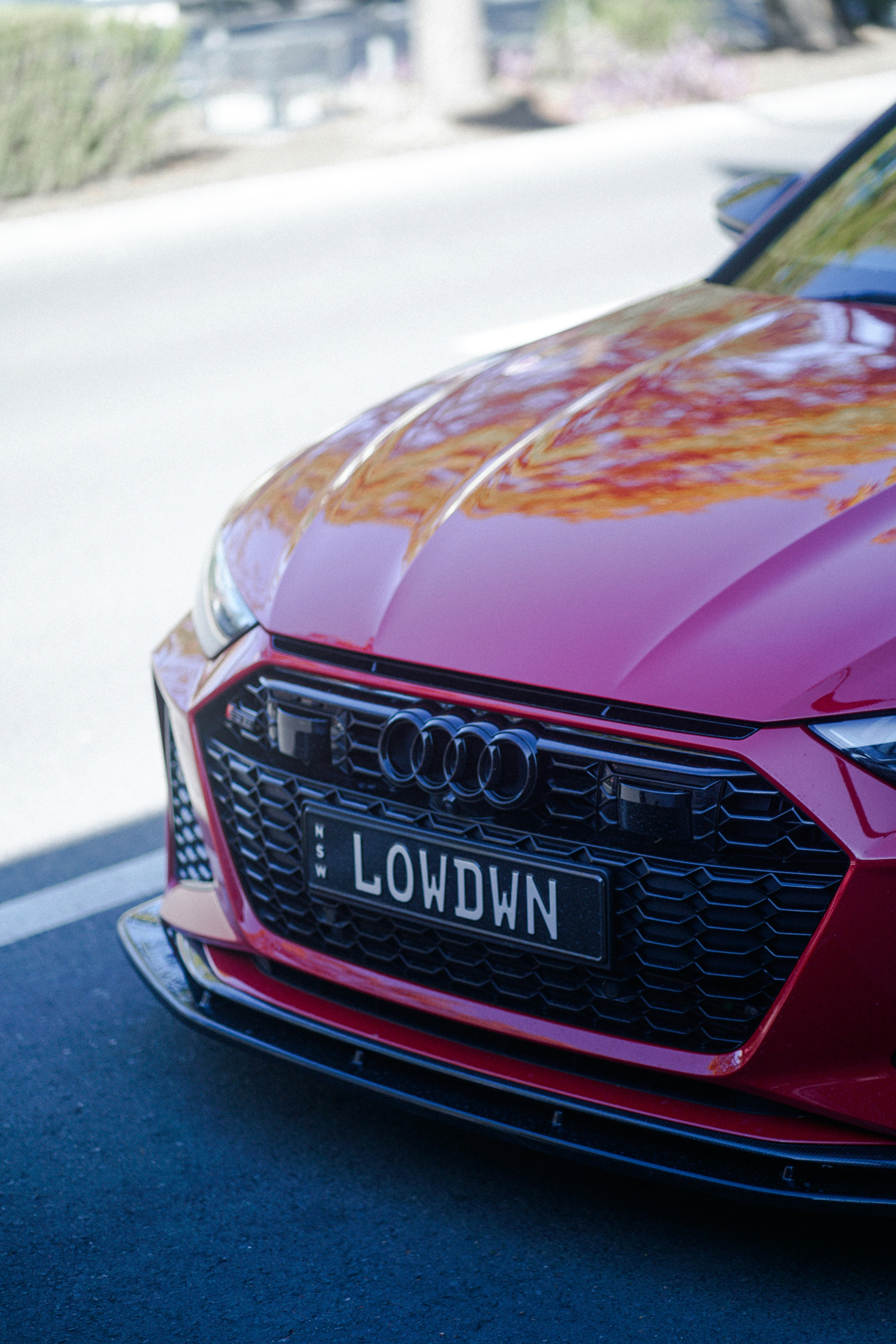 a red car parked on the side of the road