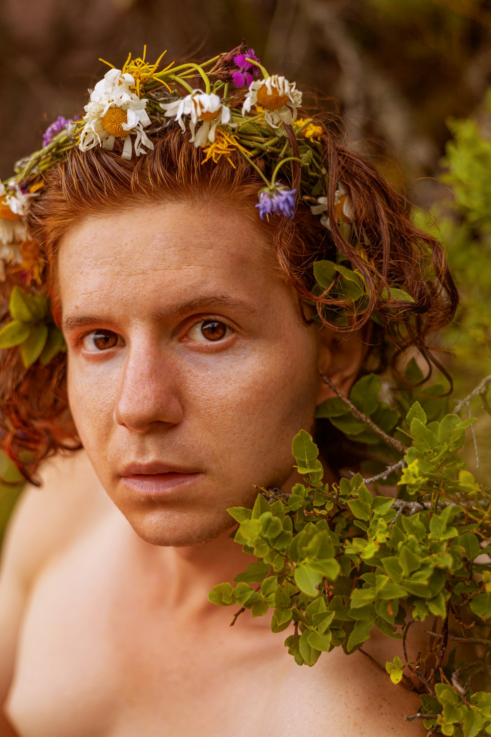 a man with a flower crown on his head