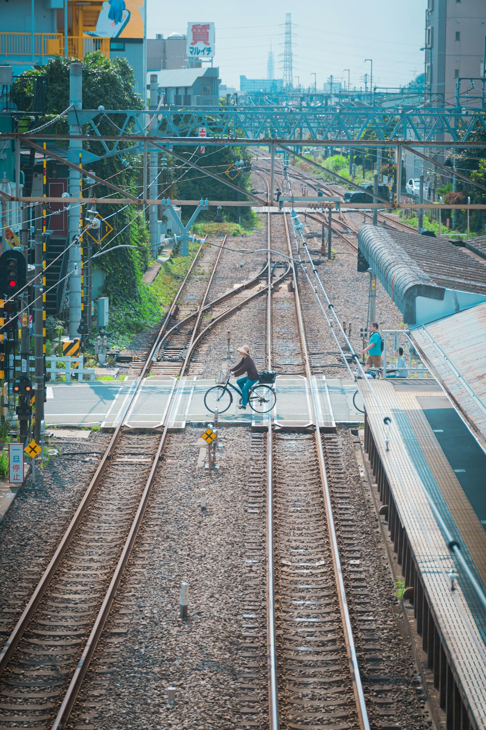 a person riding a bike on a train track