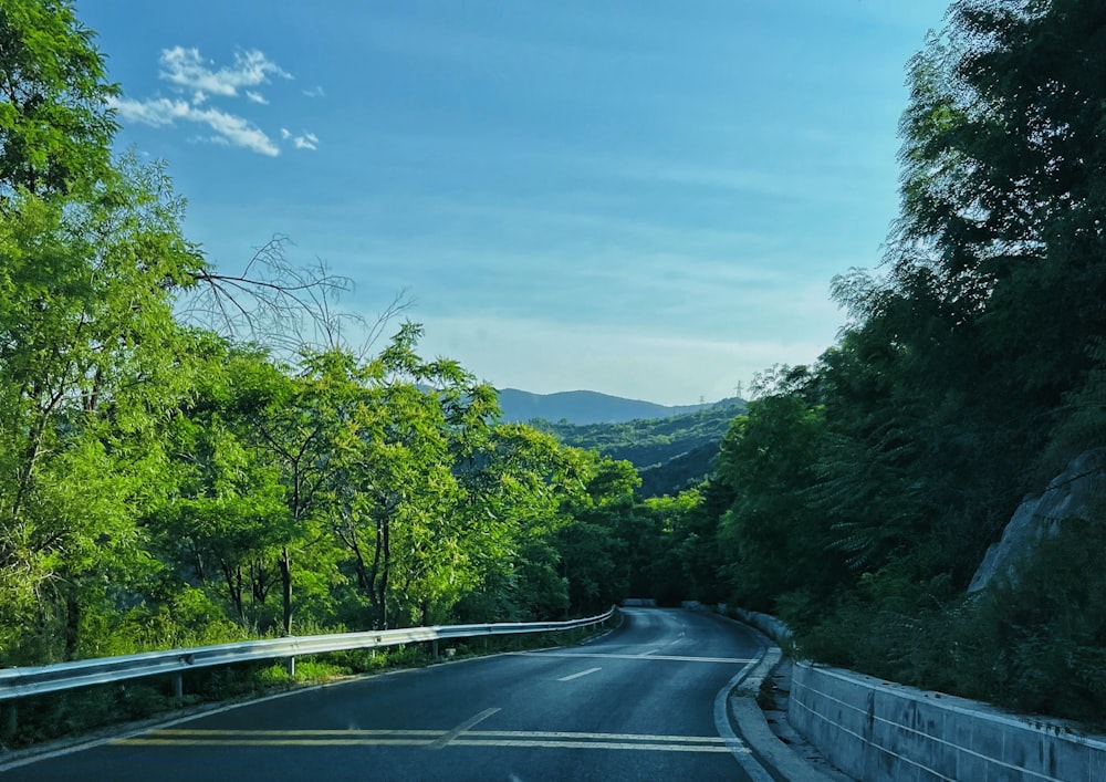 a view of a road with a mountain in the background