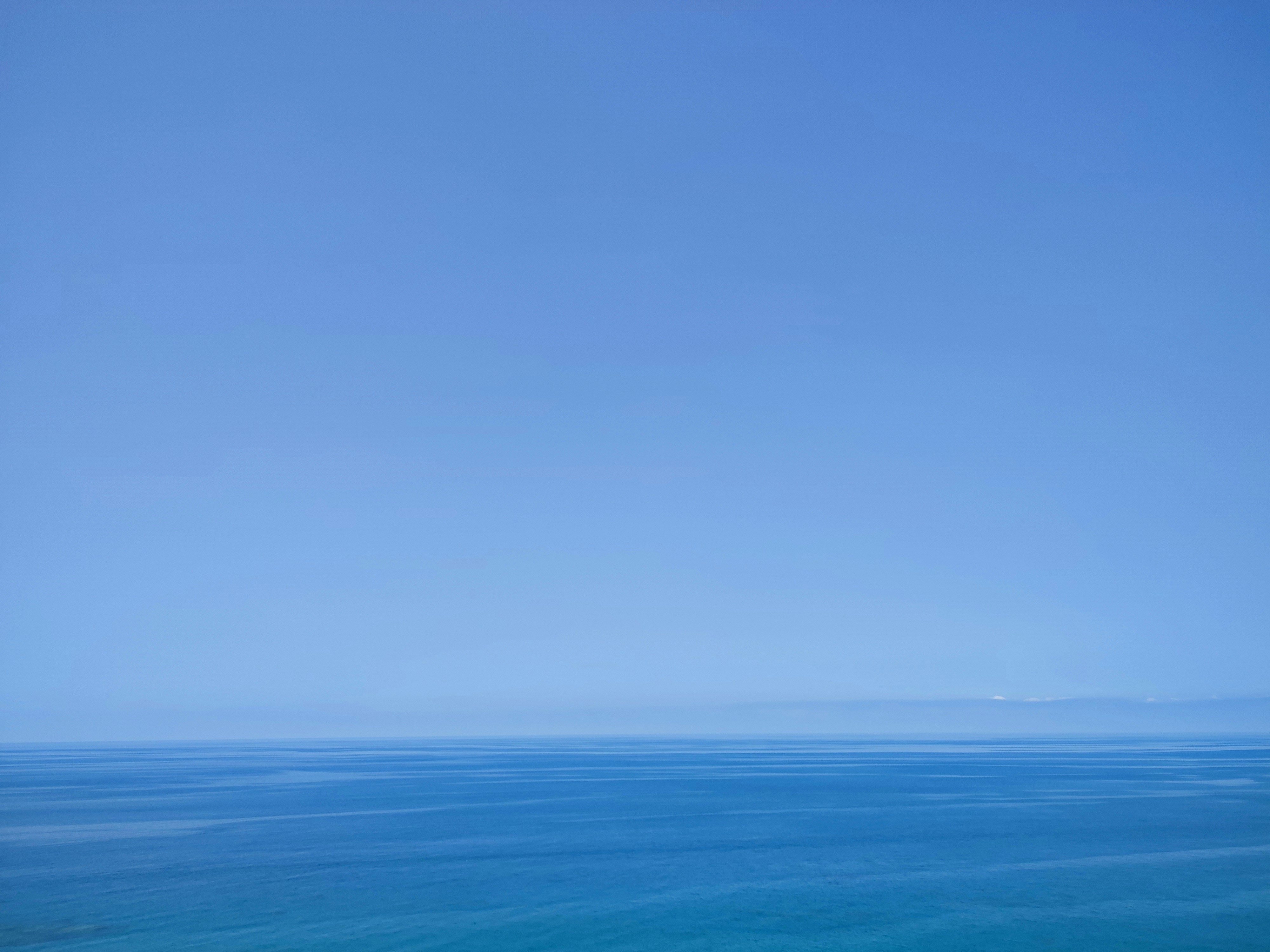 a view of a body of water from a hill