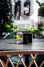a table with a vase of flowers on top of it