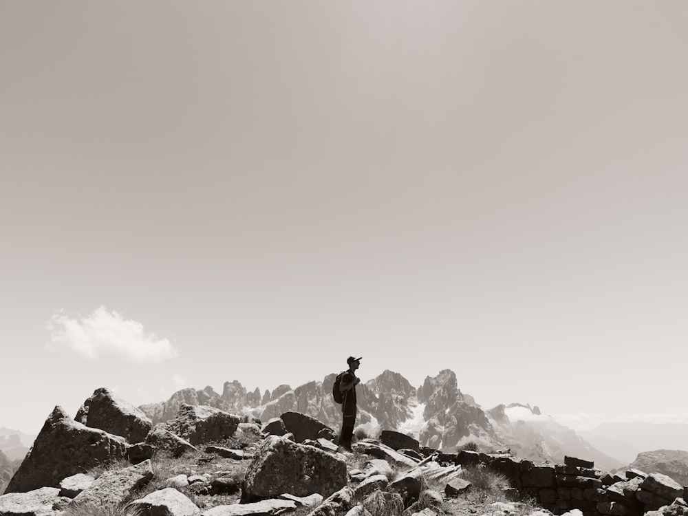 a man standing on top of a rocky mountain