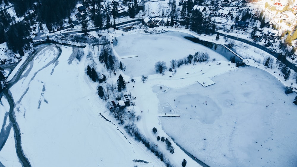 an aerial view of a snow covered park