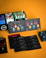 Rows of colorful guitar pedals and accessories on display