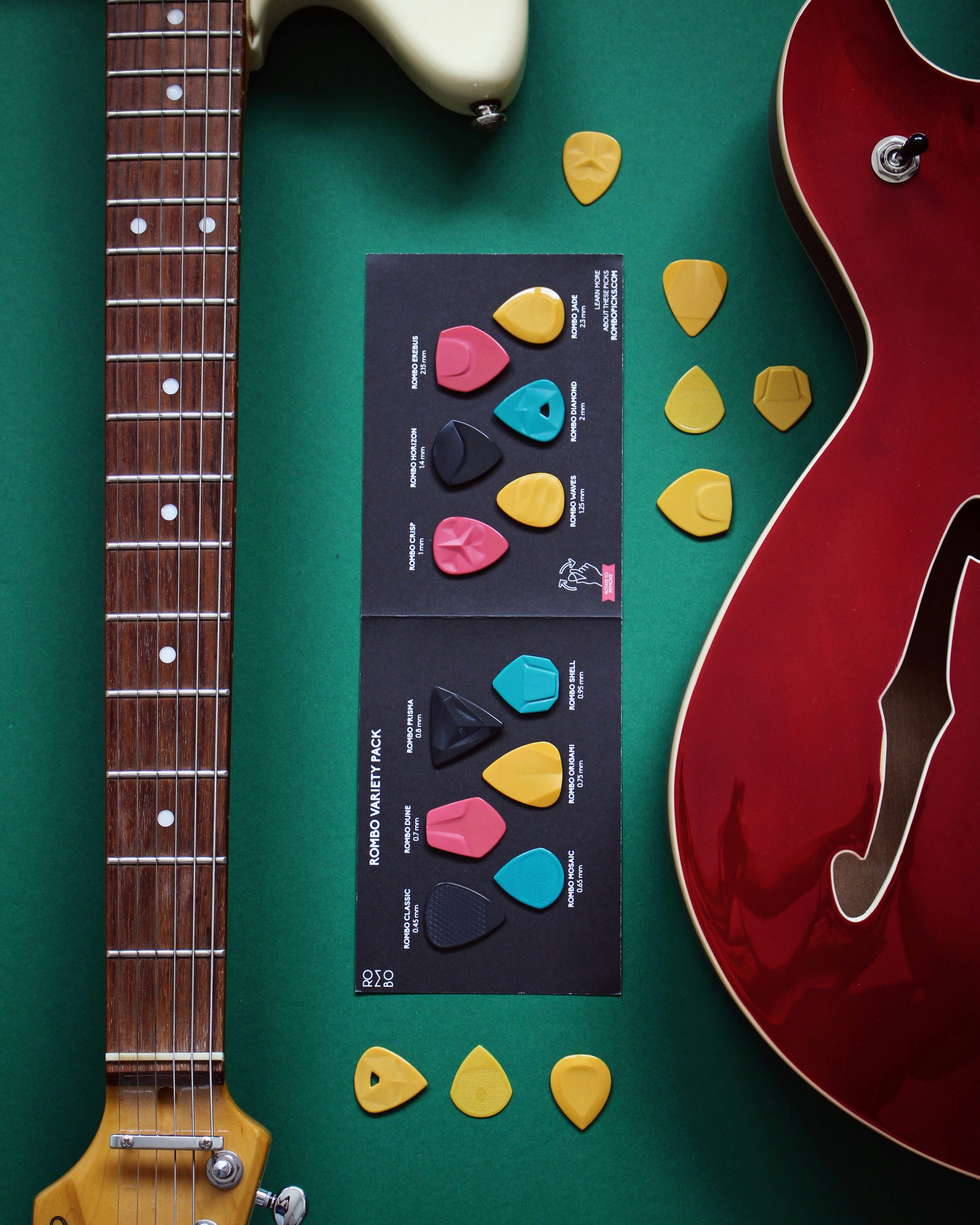 A guitar, a guitar picker, and a pair of guitar picks photo Free