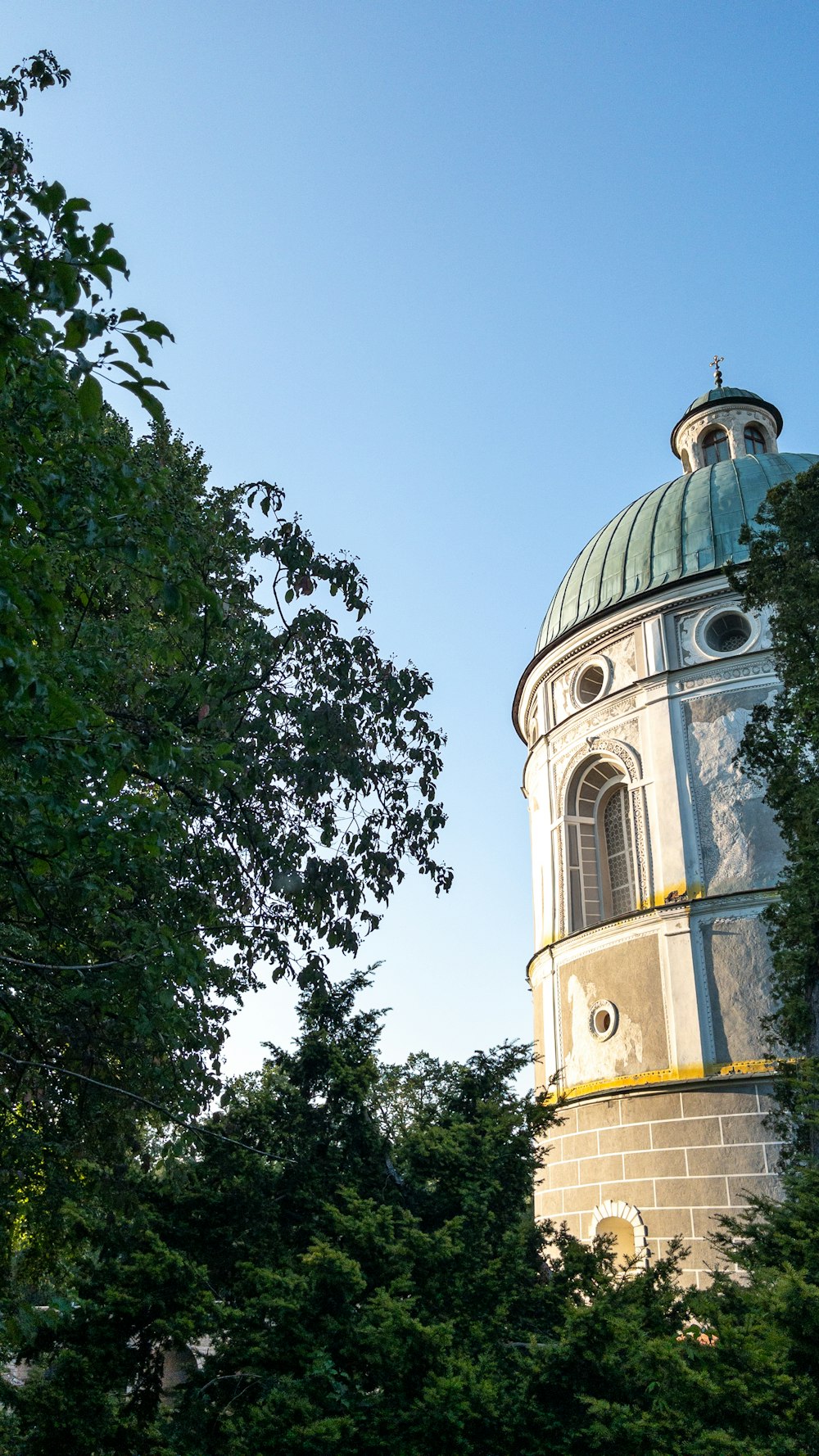 a tall tower with a clock on the top of it