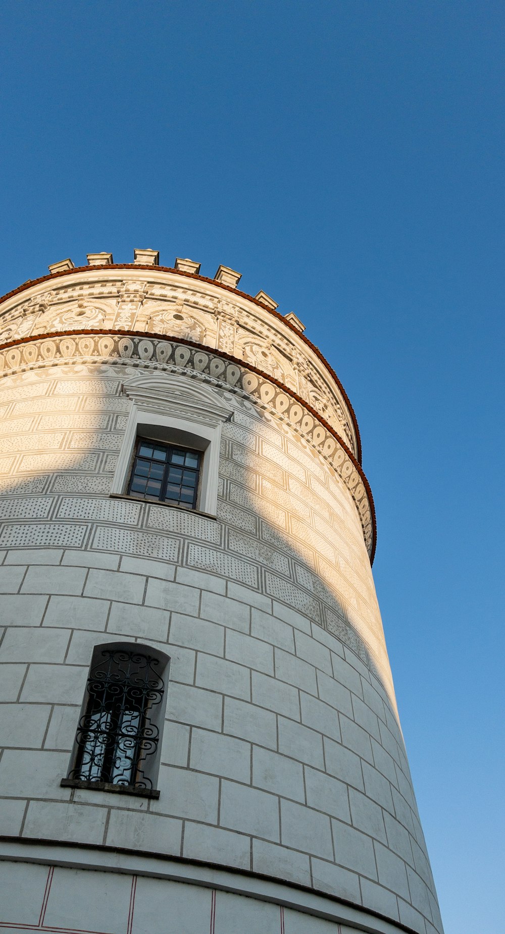 a tall tower with a clock on the top of it