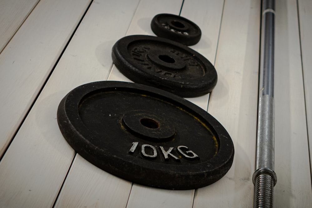 a close up of a pair of weights and a bar