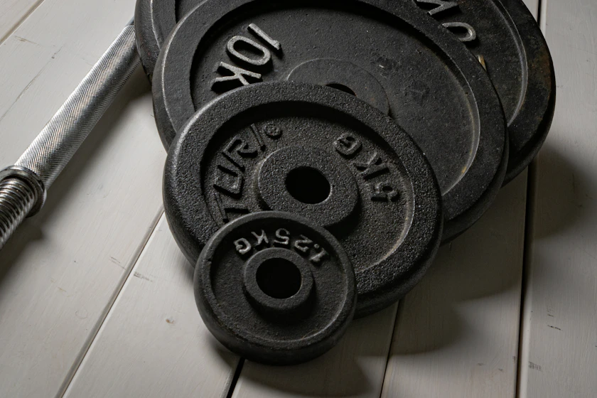 Weight plates and a barbell set up for home training