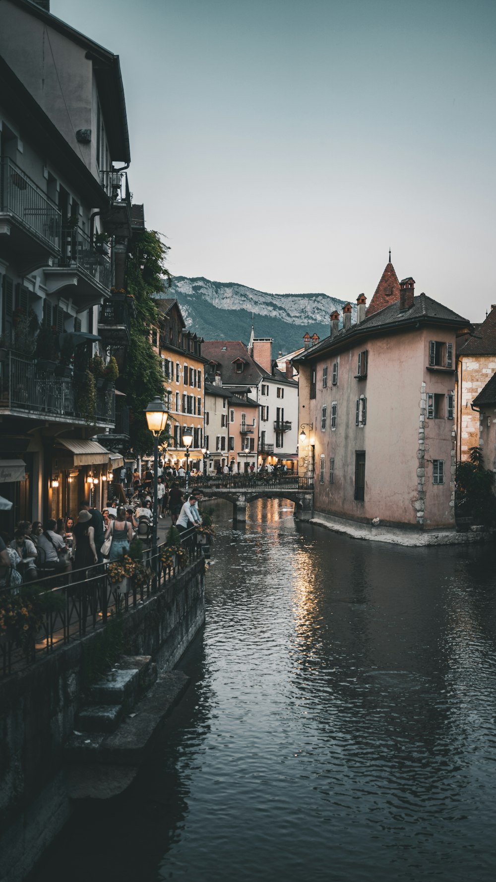 a river running through a city next to tall buildings