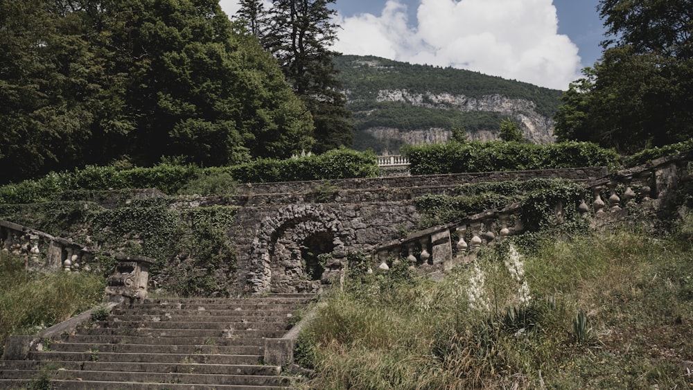 a set of stone steps leading up to a mountain