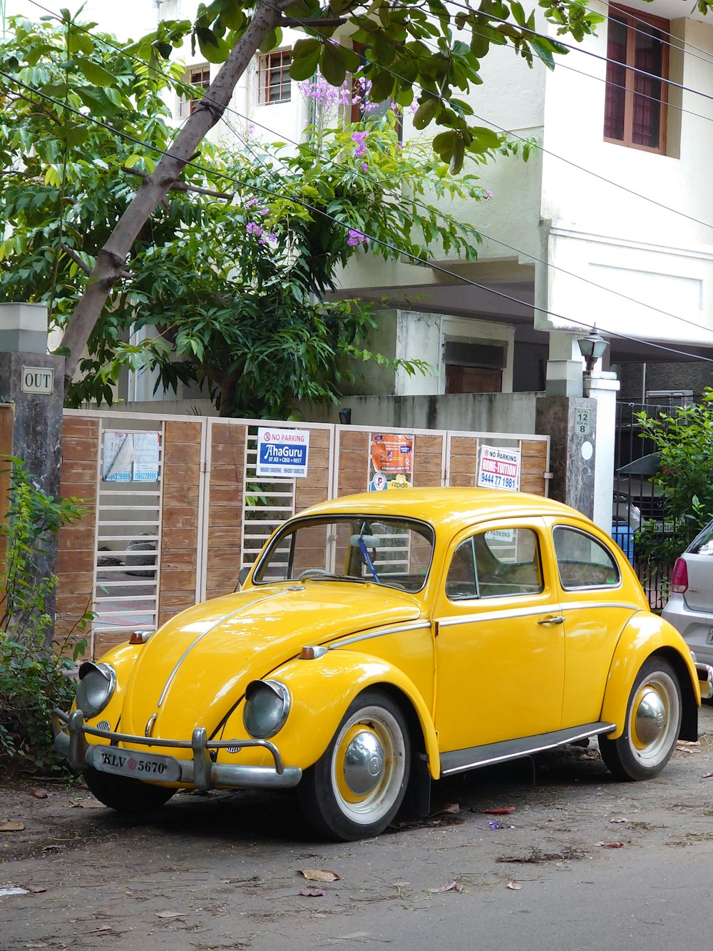 a yellow car parked on the side of the road