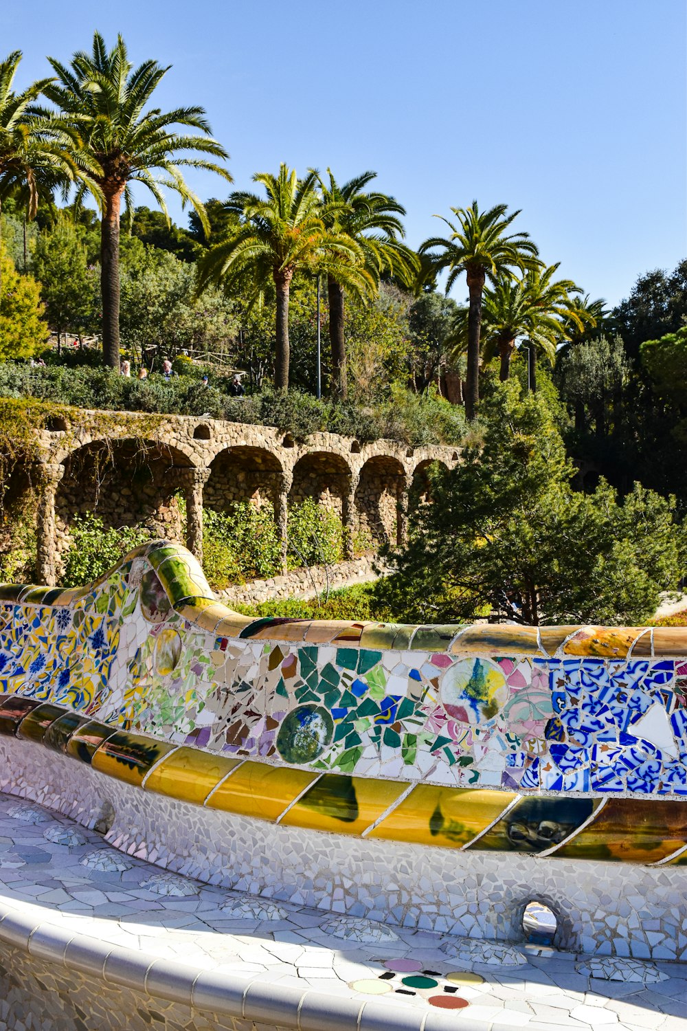 a wall covered in lots of different colored tiles