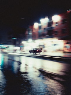 Evening shot of a Franklin Vieira Prexedes truck driving through city streets with lights on
