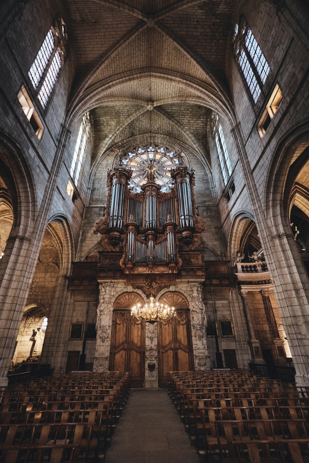 a church with a large organ in the middle of it