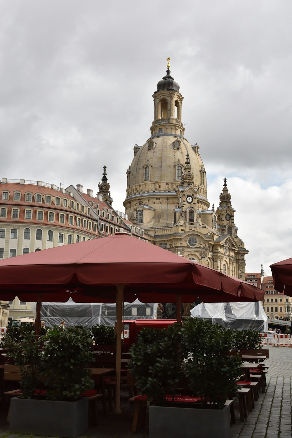 a large building with a clock tower in the background