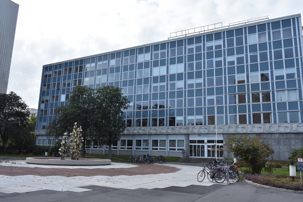 a large building with a fountain in front of it